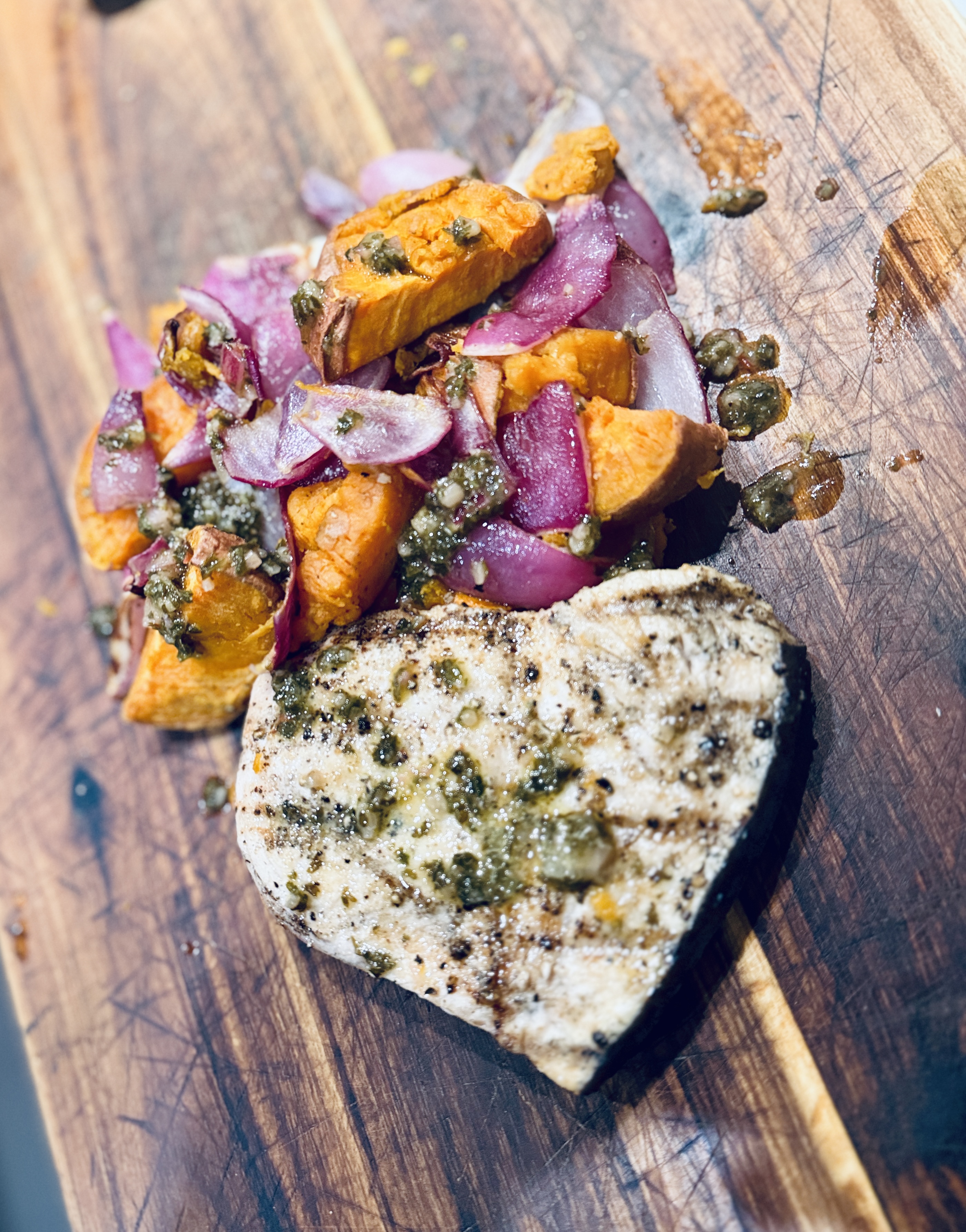 Swordfish with colorful roasted squash and red onion